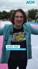 Gigantic trans flag unfurled in bid to reinstate gender affirming healthcare in QLD