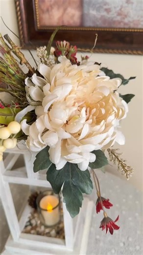 Cozy autumn vibes �This fall foliage wood lantern candleholder brings together everything loved about the season — handcrafted basswood, hand-painted details, and a faux floral arrangement of mums, acorns, pinecones, and rich wine-colored blooms. The gentle glow of the LED candle adds warmth and calm to any cozy corner or fall table display. There’s something about soft candlelight and natural textures that instantly makes a space feel like home. What is your favorite fall decor element? A. Pump