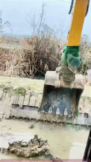 Excavator Dredging Scene The Mud Mover in the Muddy River