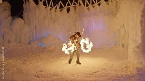 Fire Dancer In Ice Castle - Dolly Back, Wide Shot