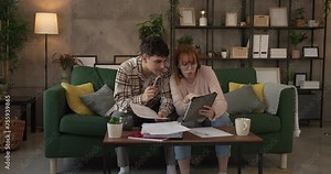 Young couple boyfriend and girlfriend or brother sister study at home