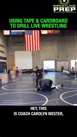 In this reel Coach Carolyn explains the use of grids (boxes and blue tape) during live training. “There are many reasons why I choose to implement and build a grid based out of boxes and blue tape, specifically to help athletes compete and implement the best math-based body position when they’re in live matches. In this particular scenario, you see two athletes who have spent several days at this point practicing and drilling with a series of 90-degree angles between key components of their body