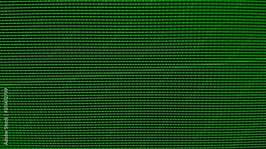 Close-up of the Monitor's Pixels. RGB pixels on the TV during the screening of the film, macro, close-up. Red, blue and green sub pixels create an image on the screen
