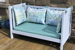 Make a summery Garden Bench out of an Old Baby Crib