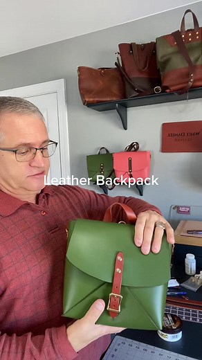 Green leather backpack.