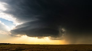 Supercell Storm Over a Field at Sunset | Premium Stock Video Footage
