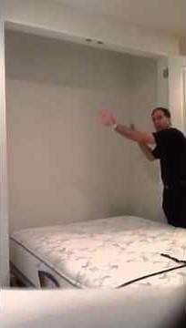 Murphy bed mechanism built into a closet