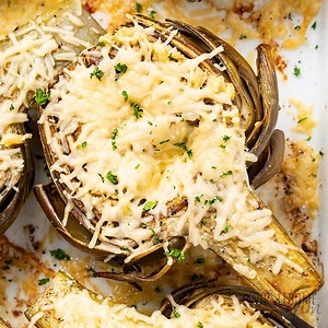 You've probably NEVER had Roasted Artichokes like this! So easy and delicious, this flavorful recipe is made with lemon, garlic, olive oil, and parmesan cheese! The absolute BEST way to eat artichokes! 😍😍😍 Printable Recipe: https://www.wholesomeyum.com/roasted-artichokes-recipe/ | Wholesome Yum - Easy Healthy Recipes