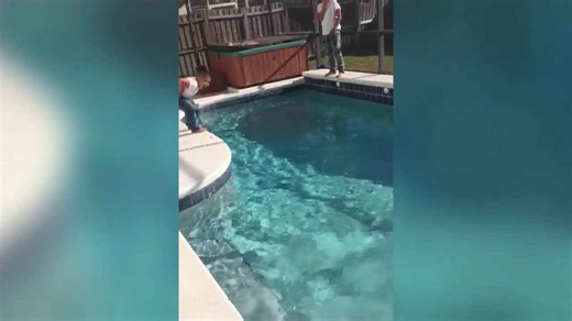 Woman Falls in A Swimming Pool with Her Clothes On