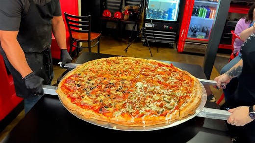 Two men attempt massive 36-inch monster pizza challenge with one-hour time limit