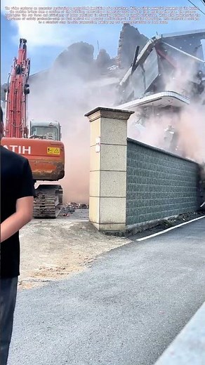 Controlled Demolition: The Power and Precision of an Excavator at Work