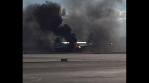 Plane catches fire on runway in Las Vegas
