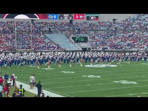 The University of Florida Gator Marching Band plays marches onto the field.