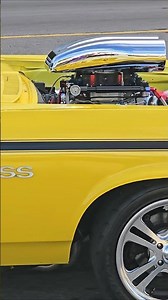 all motor 572 cubic inch V8 Chevy Nova SS custom cruises by Hard Rock at Cruisin the Coast car show