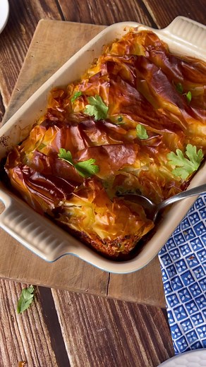 Lamb, Spinach and Filo Pie INGREDIENTS 1 Tbsp olive oil 1 onion, finely diced 2 garlic cloves, crushed 400g lamb mince ½ tsp cinnamon 1 tsp cumin 1 tsp dried herbs 1 tsp sugar 1 tsp salt ½ tsp ground black pepper 2 tsp flour 1 can crushed tomatoes, 400g RICOTTA LAYER: 300g frozen spinach 1 cup grated cheese, 100g 250g ricotta FILO TOPPING: 5 sheets of filo pastry, 130g 2 Tbsp butter, melted Method: Heat the oil in a large frying pan over a medium heat. Add the onion and garlic to the pan and sau