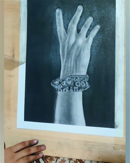 Hands and anaconda drawing charcoal pencils