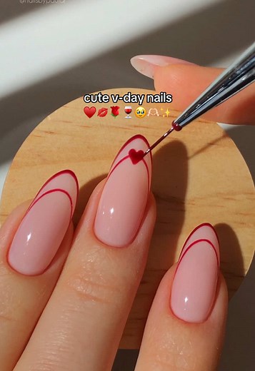 cute v-day nails! ❤️❣️🫶🏻 a minimal negative-space french mani with tiny little hearts to make it the perfect design for valentine’s day!