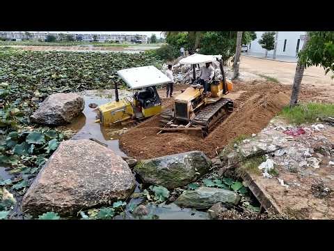 STUCK STUCK ! A Stuck Dozer in deep sand is rescued by skills operator bulldozer at a landfill site