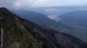 Grindelwald Bernese Alps mountain range in the clouds Switzerland aerial drone full hd 4k panoramic landscape