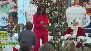 Michelle Obama dances in surprise visit with Santa