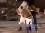 Mass brawl breaks out with six individuals fighting with a road sign