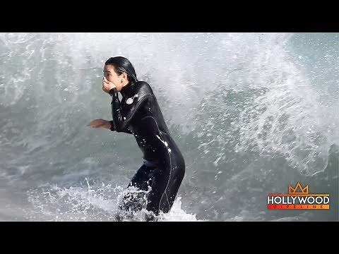 Dua Lipa Gets PUMMELED By A Wave!