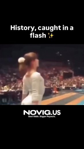 March 28, 1976. Romanian gymnast Nadia Comăneci was preparing for her second routine at the American Cup. Total focus, flawless moves—until the very moment of her final jump, when a camera flash lit up the crowd. An ordinary accident frozen in time… that only months later would gain a new meaning. Because that same season, in Montreal, Nadia achieved the impossible: the very first perfect 10 in modern Olympic gymnastics. She was only 14 years old. The scoreboard wasn’t even built to display “10.