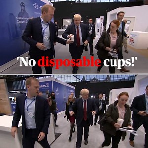 Boris Johnson was filmed having a disposable coffee cup snatched away from his hand as he arrived at day three of the Conservative party conference. Channel 4 News cameraman Neil Corbett captured the moment as Johnson was given the cup by one aide, only for a second aide to be heard saying: 'No disposable cups!' and taking the drink from the prime minister | The Guardian