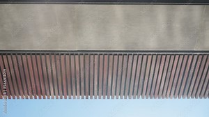 Reflection of the water of a swimming pool on the brick ceiling of a terrace of a large villa