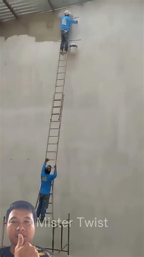The painter used a ladder to climb up and paint the wall at such a height, which is very dangerous.
