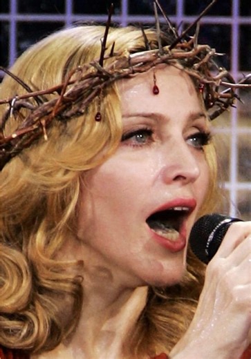 Extremist Orthodox protesters tore up photos of Madonna ahead of her Moscow concert on September 12, 2006, accusing her of blasphemy for using Christian imagery in her performances. The outrage focused on imagery from her Confessions Tour, most famously her performance of “Live to Tell,” which featured a crucifix, a crown of thorns, and references to the Virgin Mary. #madonna #popculture #provocative #targetaudience