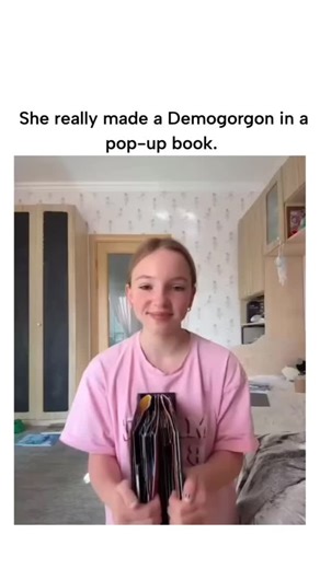 Global reel hub on Instagram: "#The post features a viral video of a young woman demonstrating a intricate pop-up book where a Demogorgon from Stranger Things emerges dramatically upon opening, garnering over 2 million views and 41,000 likes for its impressive craftsmanship. Contrary to the caption claiming "she really made" it, the book is actually engineered and illustrated by paper artist Simon Arizpe as part of a Stranger Things pop-up series, with the woman simply showcasing the pre-made pr
