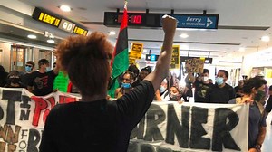 Eric Garner's family and friends protest in Staten Island