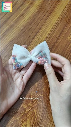 Make a stylish bow with beads inside—perfect for dresses & hair!#DIYBow #BeadedBow #HairAccessories