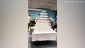 Moment waiter causes champagne tower to crash to the ground