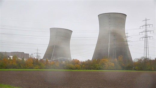 Nuclear power plant cooling towers collapse in controlled demolition