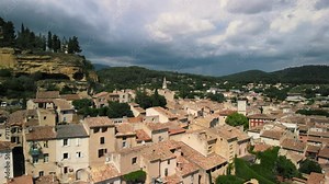 Drone view of stone and clay homes in a beautiful village in Cadenet, Provence, France