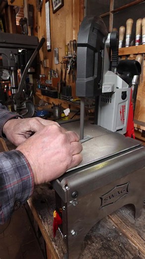 Portable band saw with Swag Off Road stand