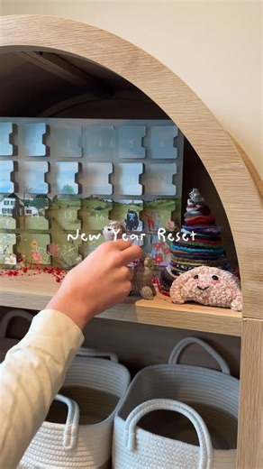 Natalie aka Knitty Natty on Instagram: "In my new space, I’m using my yarn shelf as more of a work station than a display case. One shelf for yarn, one for WIPs, and one for tools and whimsy ✨ I need to keep playing with the arrangement, but it’s working great so far :)"