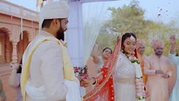 In this traditional Hindu wedding ceremony, the newly married couple...