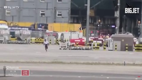Bizarre moment Big Jet TV films man running around on Heathrow airport