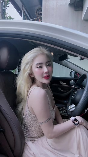 Car Interior Essentials: Stylish Driving in a Beige Dress