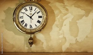 The dials of the old antique classic clocks on a vintage wide paper background. Concept of time,