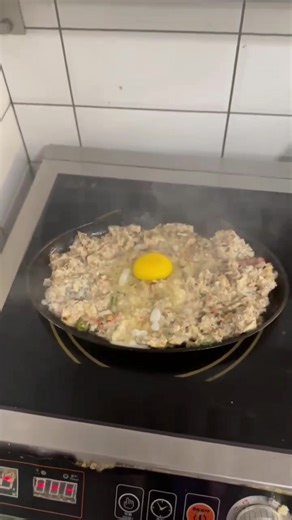 Our sizzling sisig is a savory mix of seasoned pork, onions, and chili, served hot on a sizzling plate with a creamy egg on top! #pilipinoFood #everyone @nurse.kathlcmbr #everybody #fyp #filipinofood #pinoyfood