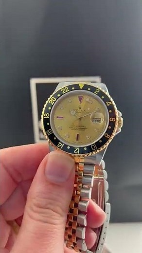 Rolex GMT Master II Diamond Ruby Serti Dial Steel Yellow Gold Watch 16713 Review | SwissWatchExpo
