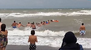 Beachgoers In Argentina Form A Human Chain To Rescue Struggling Swimmers