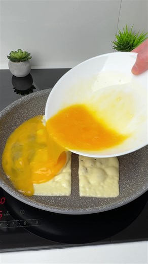 #VNVideoEditor A DELICIOUS SANDWICH WITH A LOT OF CHEESE. You Won't Believe the EASIEST Way to Make a DELICIOUS CHEESE SANDWICH INGREDIENTS: ●Bread slices - 2 pcs. ●Cheese slices - 4 pcs. (100 g) ●Eggs - 3 pcs. ●Salt - 1/2 tsp ●Grated hard cheese - 50 g ●Vegetable oil - 1 tsp. 1. Make a hole in two pieces of bread using a glass. 2. Grease a frying pan with vegetable oil and put 4 slices of cheese on top. 3. Pour the salted egg mixture on top and put the pieces of bread on top. Immediately turn t