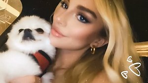 Model Grace Lindley poses with her dog