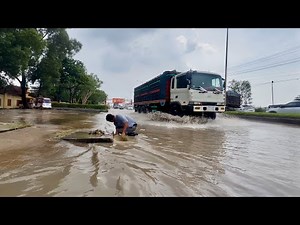 Fighting Floods Clearing Clogged Drains Amidst a Storm
