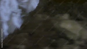 Super closeup of chunks of snow being pushed by industrial loader bucket